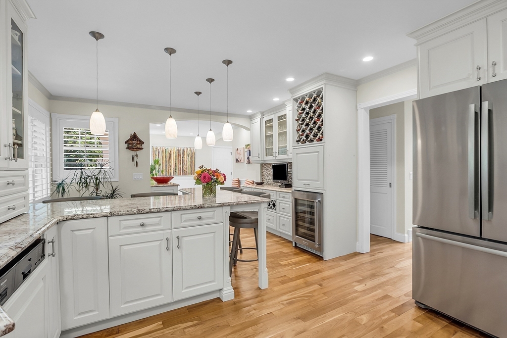 595 Salisbury Street Worcester, MA 01609 - Photo 11 of 41 a kitchen with white cabinets and stainless steel appliances