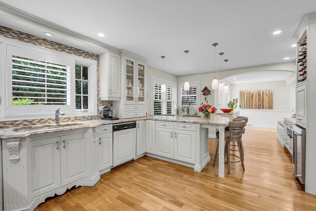 595 Salisbury Street Worcester, MA 01609 - Photo 12 of 41 a kitchen with a sink dining table and chairs