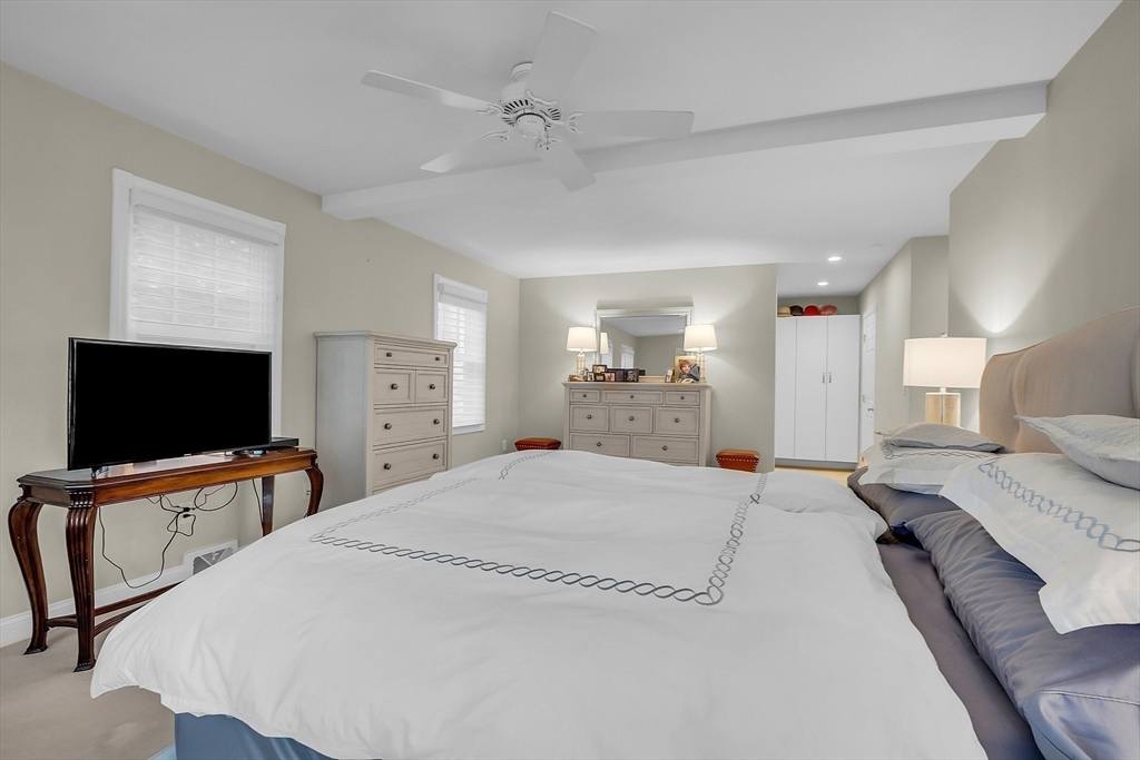 595 Salisbury Street Worcester, MA 01609 - Photo 18 of 41 a large bedroom with a bed and a flat screen tv
