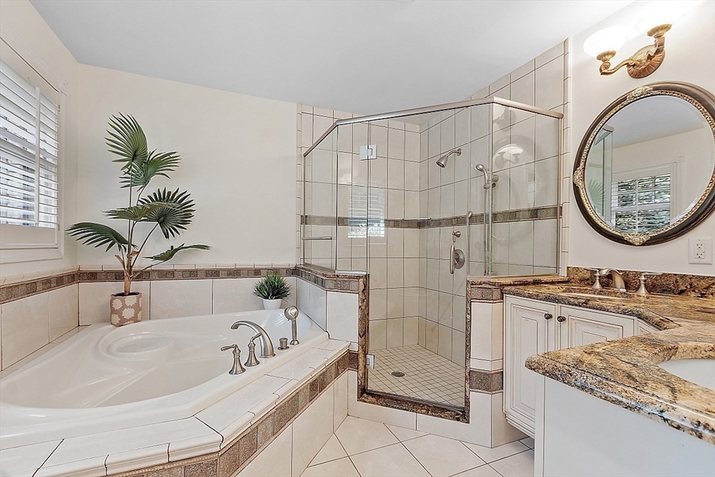 595 Salisbury Street Worcester, MA 01609 - Photo 19 of 41 a bathroom with a tub sink and mirror