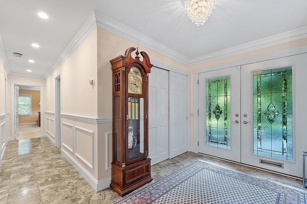 595 Salisbury Street Worcester, MA 01609 - Photo 2 of 41 a view of a hallway with windows and stairs
