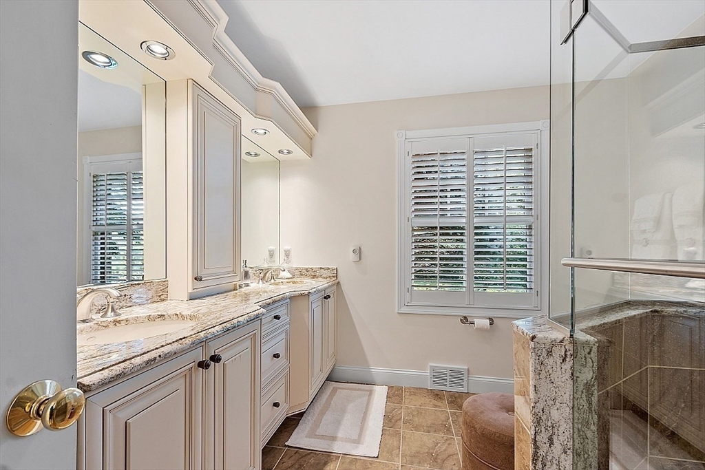 595 Salisbury Street Worcester, MA 01609 - Photo 21 of 41 a spacious bathroom with a granite countertop tub sink and a window