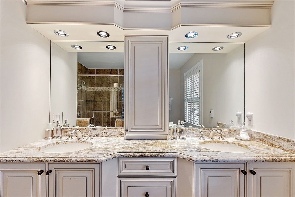595 Salisbury Street Worcester, MA 01609 - Photo 22 of 41 a bathroom with a granite countertop sink and a mirror