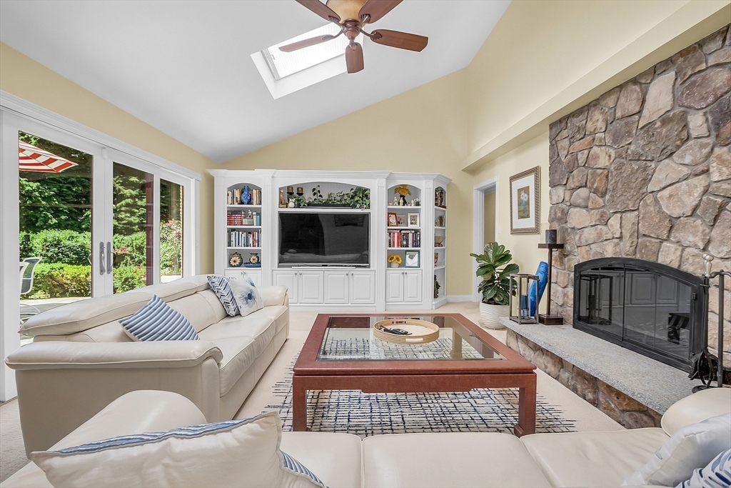 595 Salisbury Street Worcester, MA 01609 - Photo 5 of 41 a living room with furniture a flat screen tv and a fireplace