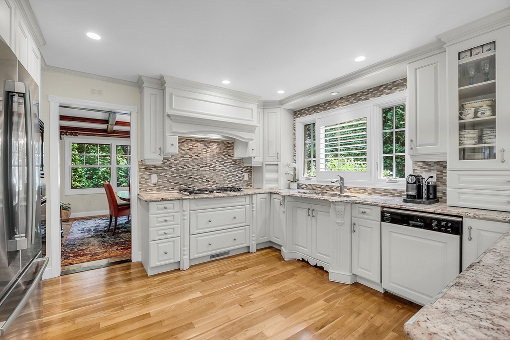 595 Salisbury Street Worcester, MA 01609 - Photo 9 of 41 a kitchen with granite countertop white cabinets and white appliances