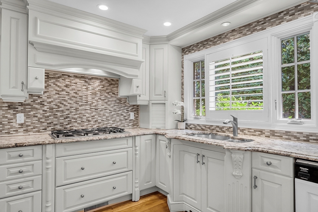 595 Salisbury Street Worcester, MA 01609 - Photo 10 of 41 a kitchen with stainless steel appliances granite countertop white cabinets and window