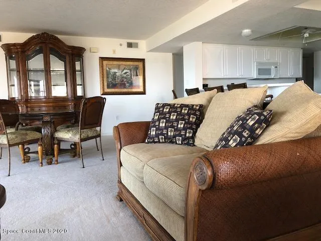 a view of a livingroom with furniture and windows