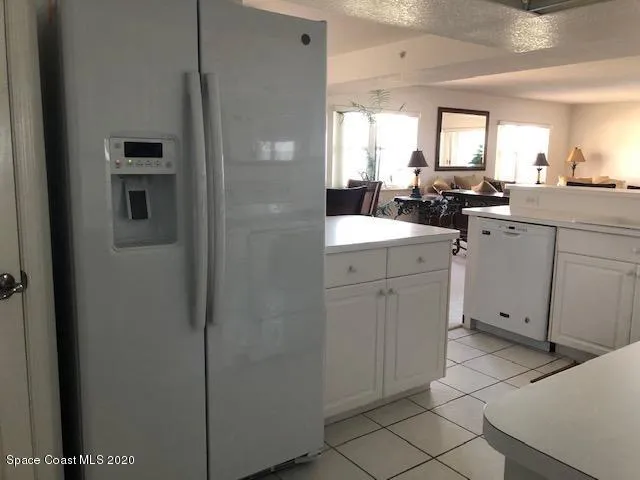 a kitchen with cabinets and appliances