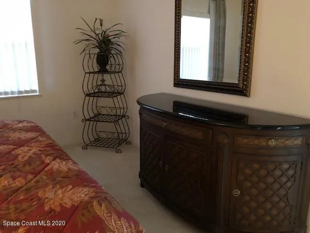 a bathroom with a toilet sink and a shower