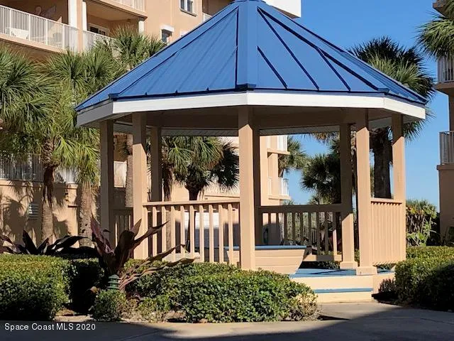 a living room with furniture and a chair