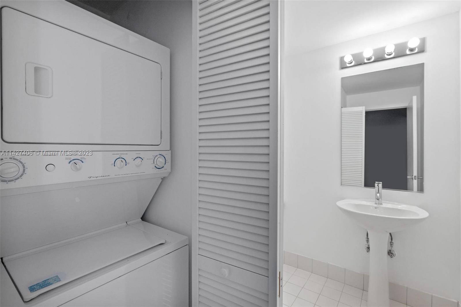 888 Biscayne Boulevard, Unit 2208 Miami, FL 33132 - Photo 18 of 20 a view of utility room with washer and dryer