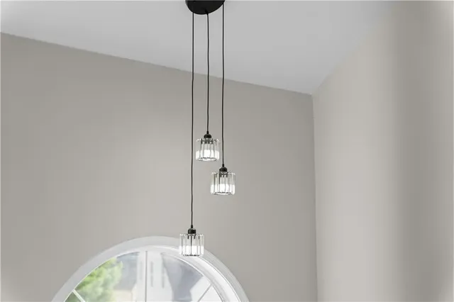 a view of a kitchen with wooden floor and a sink