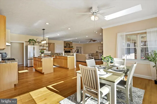 a bedroom with a bed a dresser and book shelf