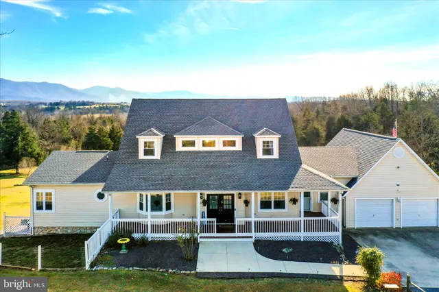 a living room with furniture ceiling fan and a rug