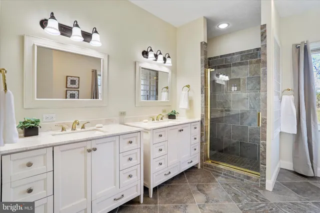 a view of a hallway with wooden floor and windows