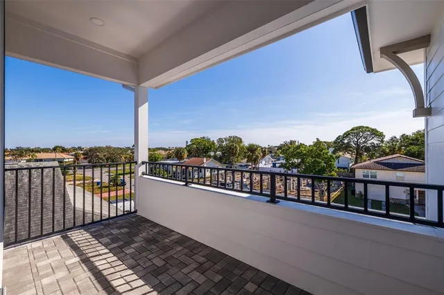 a view of a balcony with wooden floor