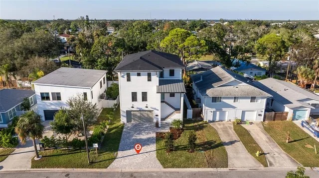 aerial view of a house with a yard