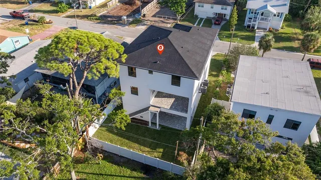 an aerial view of a house with a garden