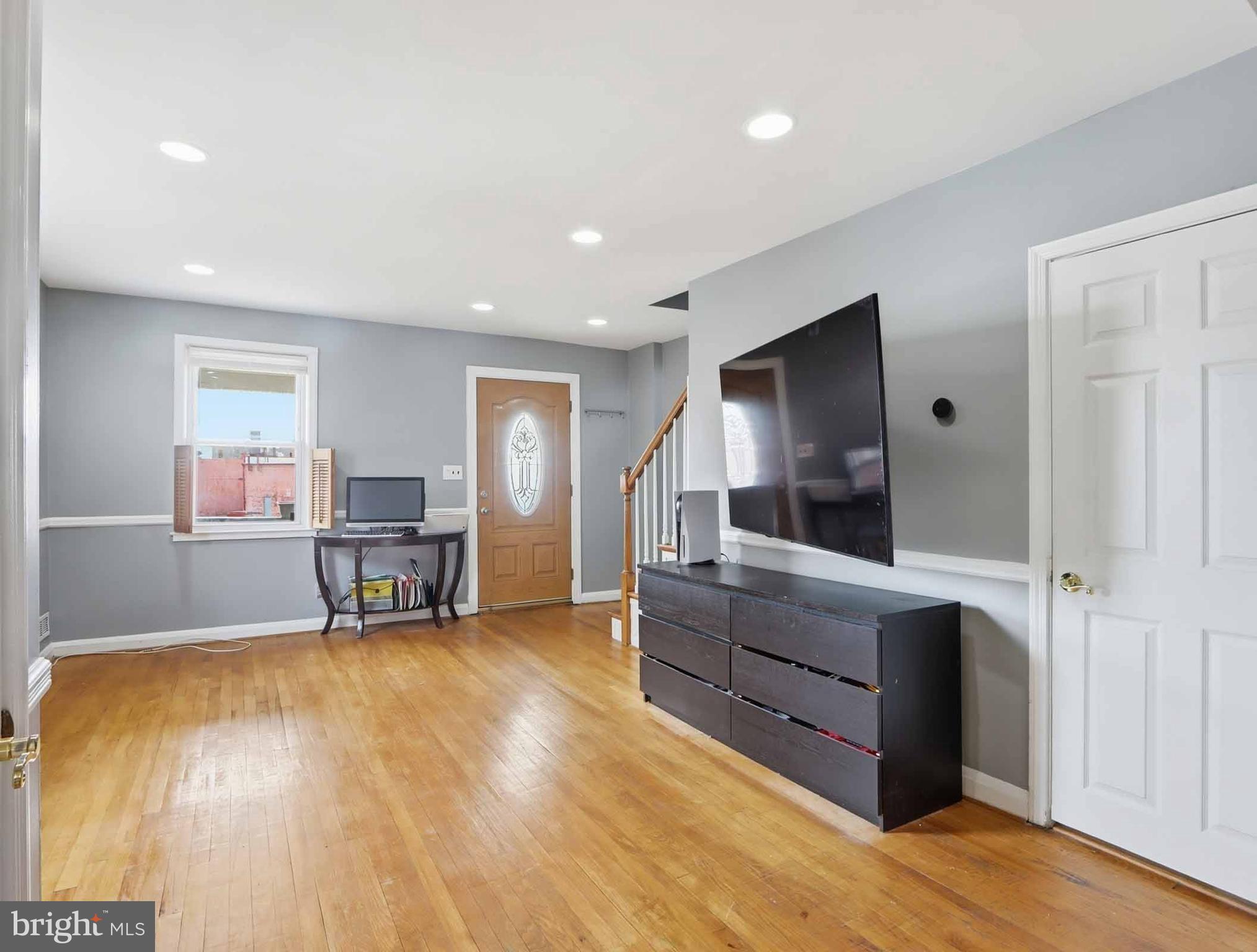 6832 Broening Road Baltimore, MD 21222 - Photo 11 of 34 a room with furniture and a flat screen tv