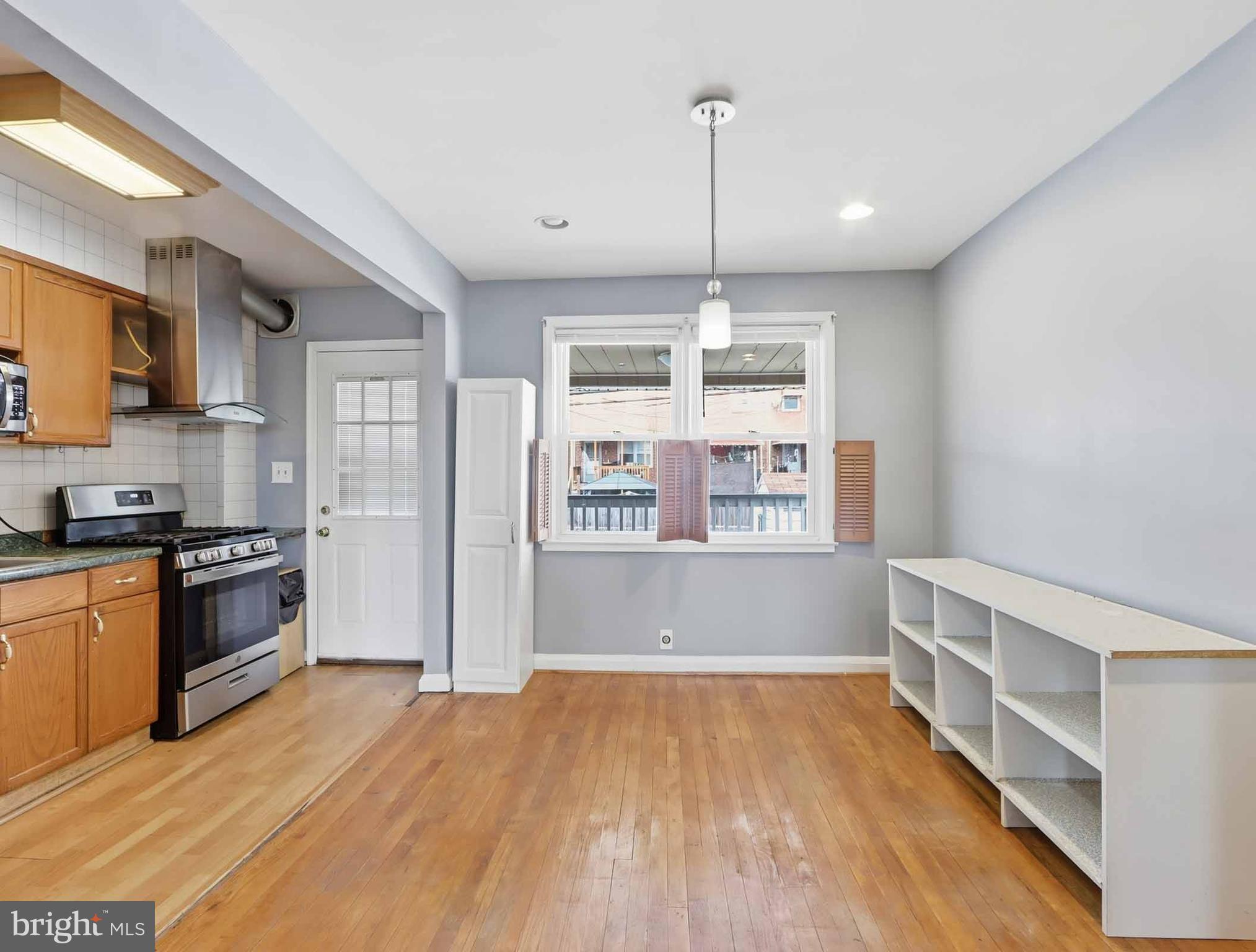 6832 Broening Road Baltimore, MD 21222 - Photo 12 of 34 a view of an empty room with window and wooden floor
