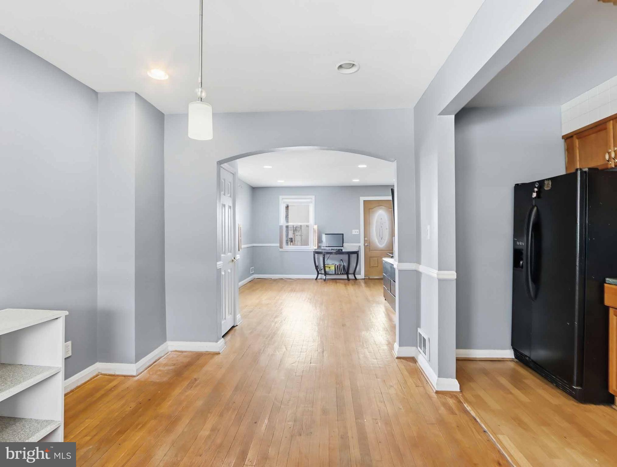 6832 Broening Road Baltimore, MD 21222 - Photo 15 of 34 a very nice looking room with a large bed and a chandelier