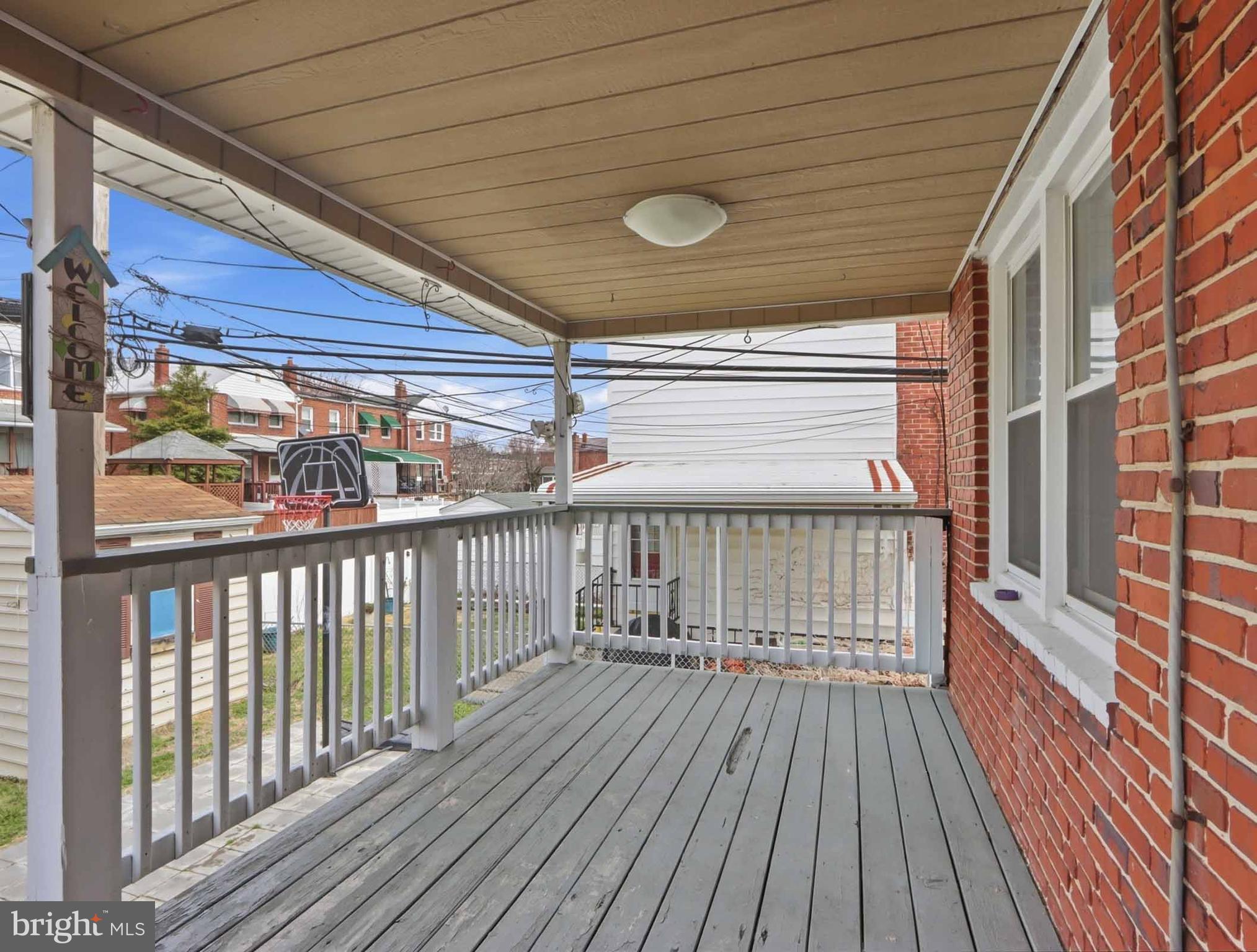 6832 Broening Road Baltimore, MD 21222 - Photo 2 of 34 a view of a balcony with wooden floor