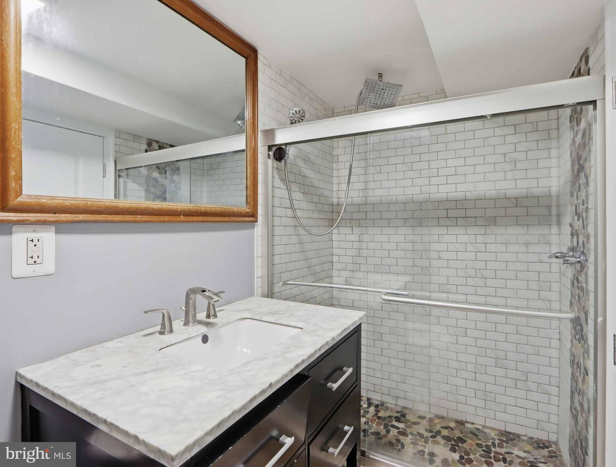 6832 Broening Road Baltimore, MD 21222 - Photo 21 of 34 a bathroom with a sink and a mirror