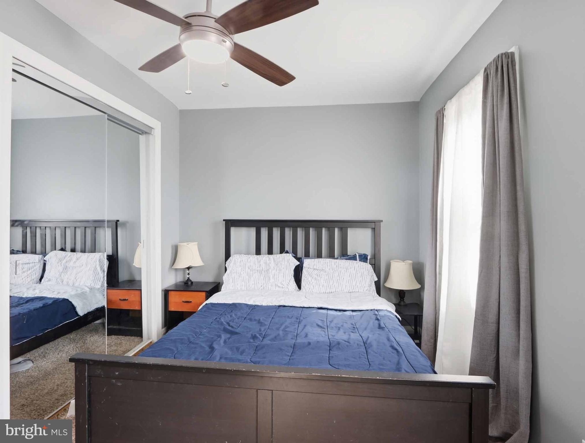 6832 Broening Road Baltimore, MD 21222 - Photo 30 of 34 a bedroom with a large bed and a window