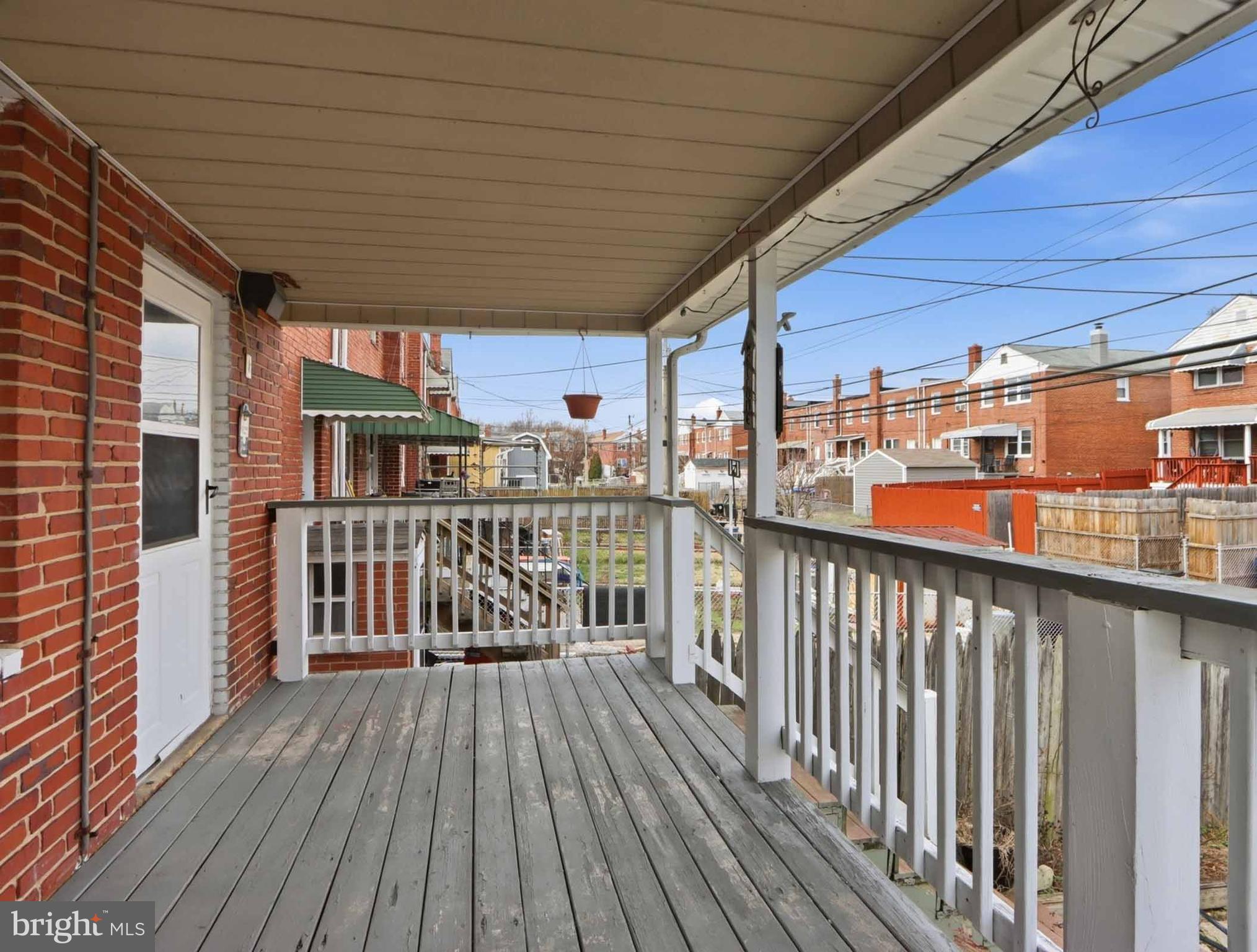 6832 Broening Road Baltimore, MD 21222 - Photo 3 of 34 a view of a balcony with wooden floor