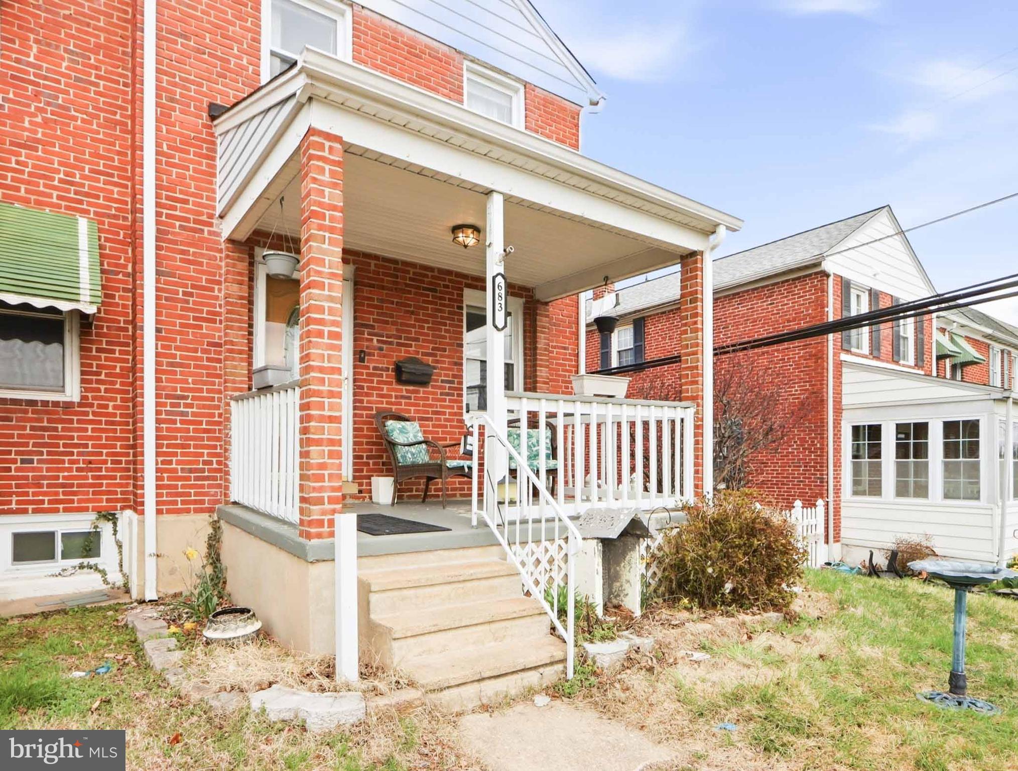6832 Broening Road Baltimore, MD 21222 - Photo 6 of 34 a front view of a house with a yard