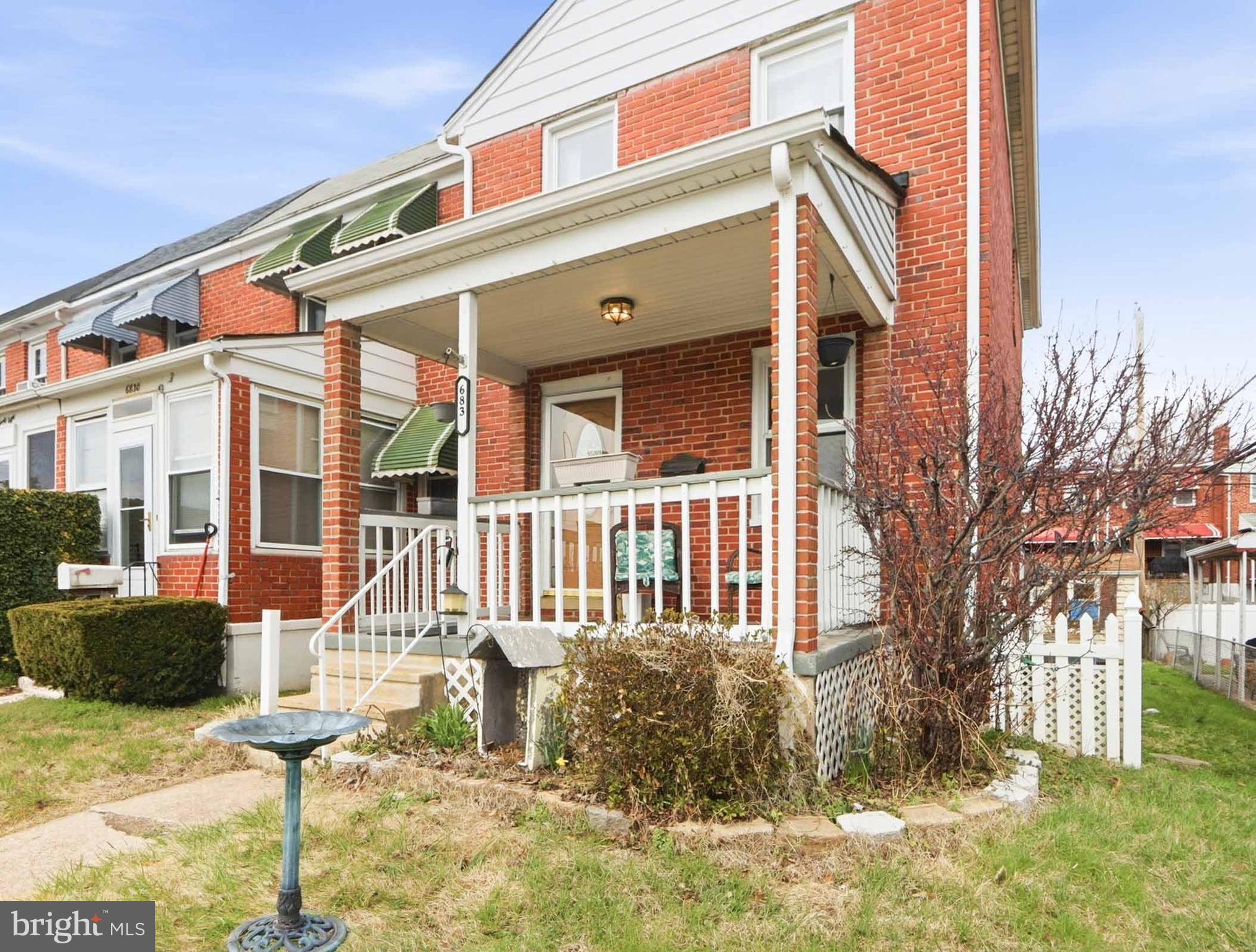 6832 Broening Road Baltimore, MD 21222 - Photo 7 of 34 a front view of a house with a yard