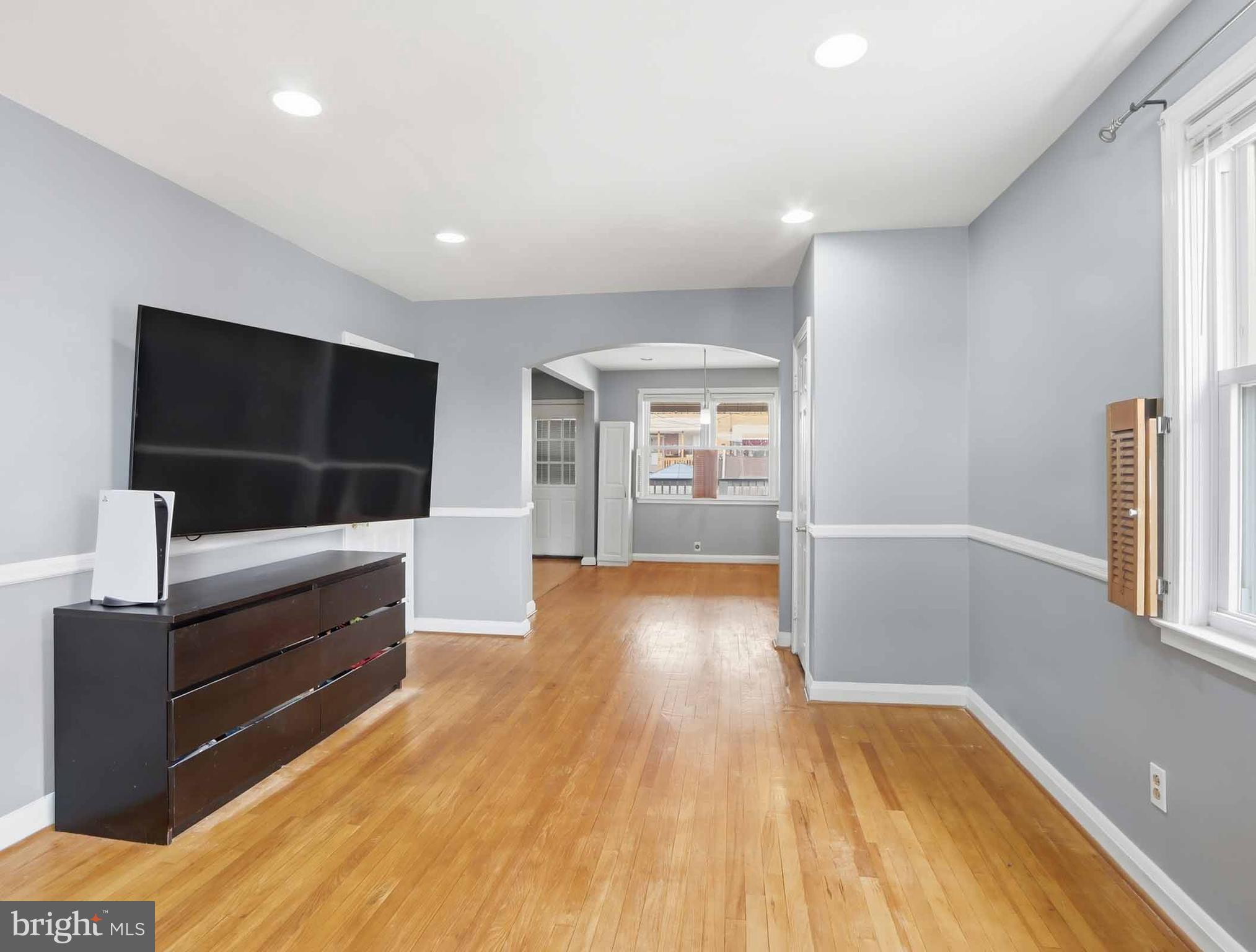6832 Broening Road Baltimore, MD 21222 - Photo 9 of 34 a view of hallway with wooden floor and furniture