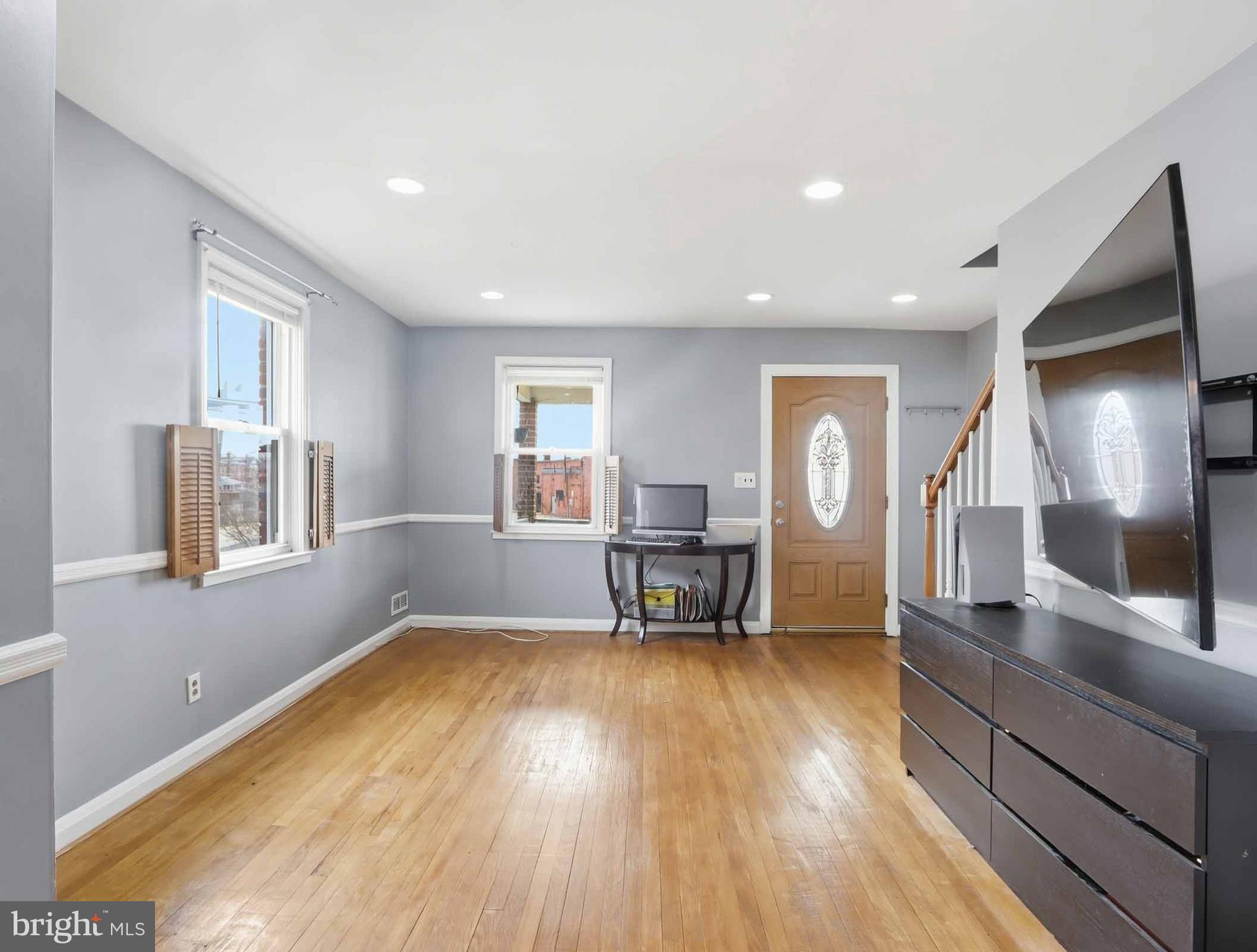 6832 Broening Road Baltimore, MD 21222 - Photo 10 of 34 a living room with furniture and a wooden floor