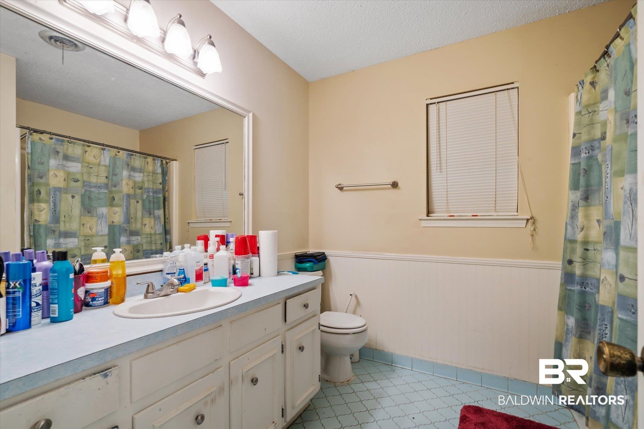 6657 Hounds Run South Mobile, AL 36608 - Photo 11 of 20 Bathroom featuring tile patterned flooring, toilet, a textured ceiling, and vanity