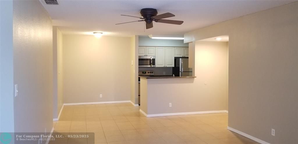 2846 South University Drive, Unit 4205 Davie, FL 33328 - Photo 2 of 9 a view of a kitchen with a sink and a cabinet