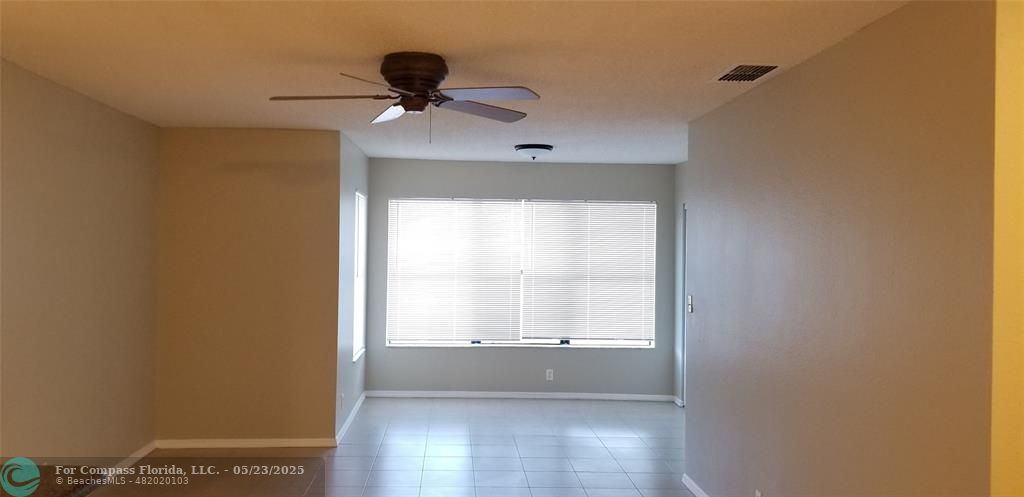 2846 South University Drive, Unit 4205 Davie, FL 33328 - Photo 4 of 9 a view of an empty room with a window