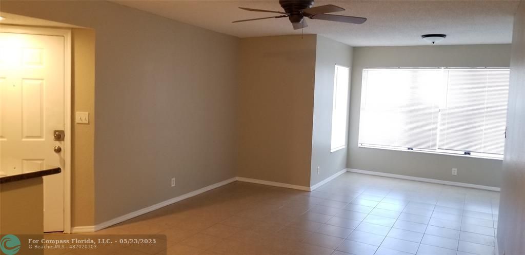 2846 South University Drive, Unit 4205 Davie, FL 33328 - Photo 6 of 9 a view of an empty room and a window