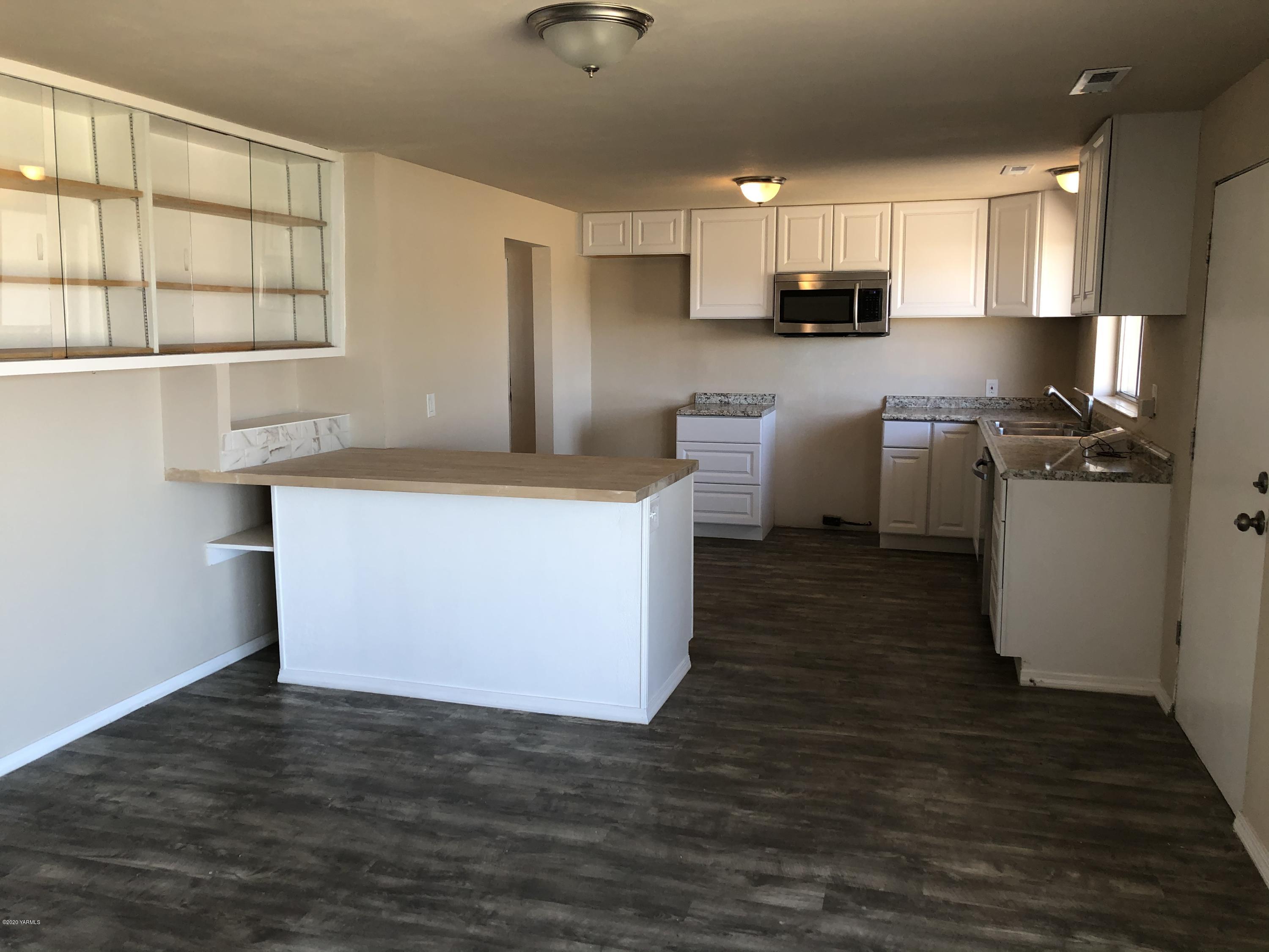 4950 Lateral A Road Wapato, WA 98951 - Photo 12 of 31 a kitchen with stainless steel appliances a refrigerator sink and microwave