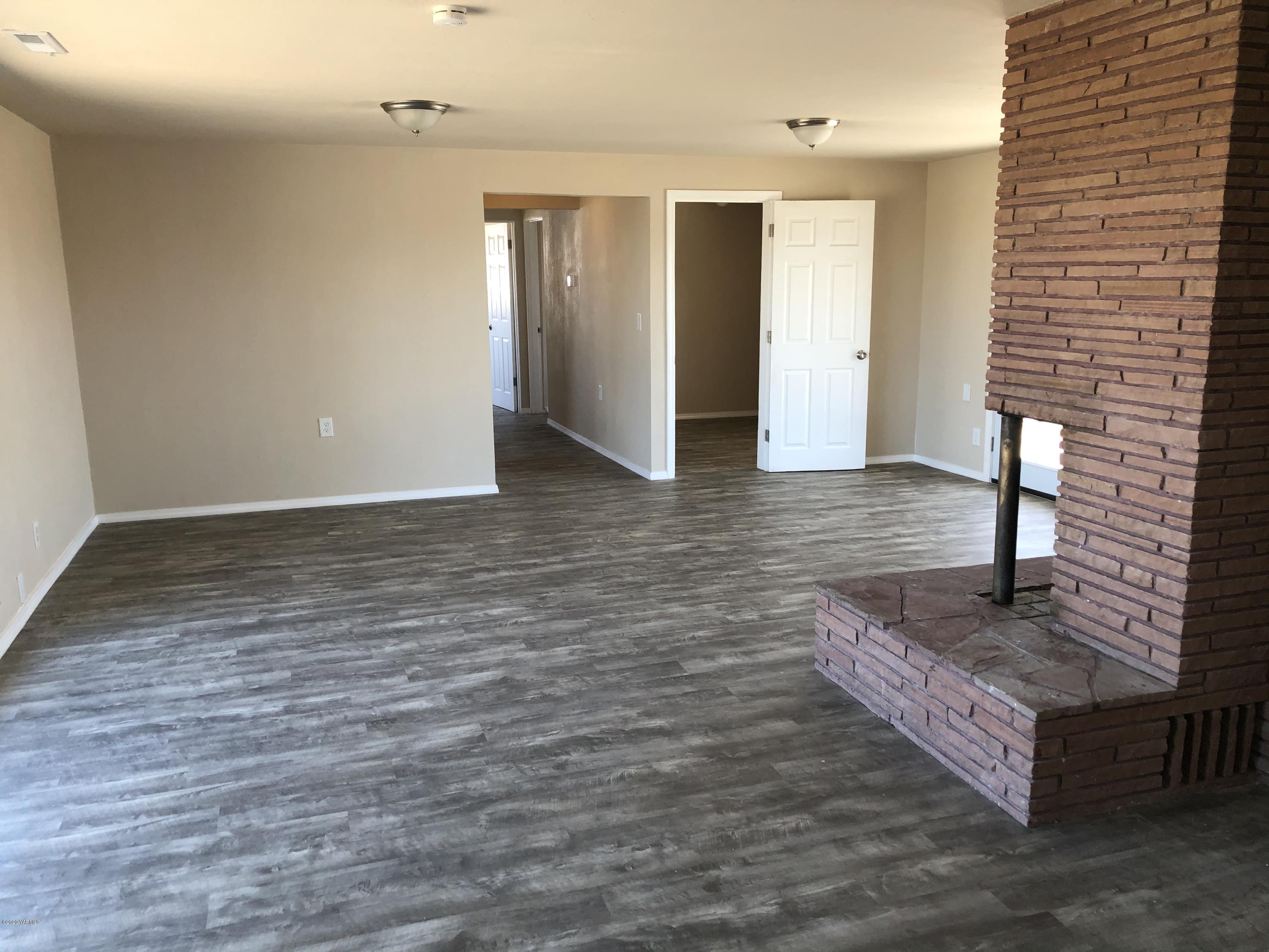 4950 Lateral A Road Wapato, WA 98951 - Photo 13 of 31 a view of a hallway with wooden floor