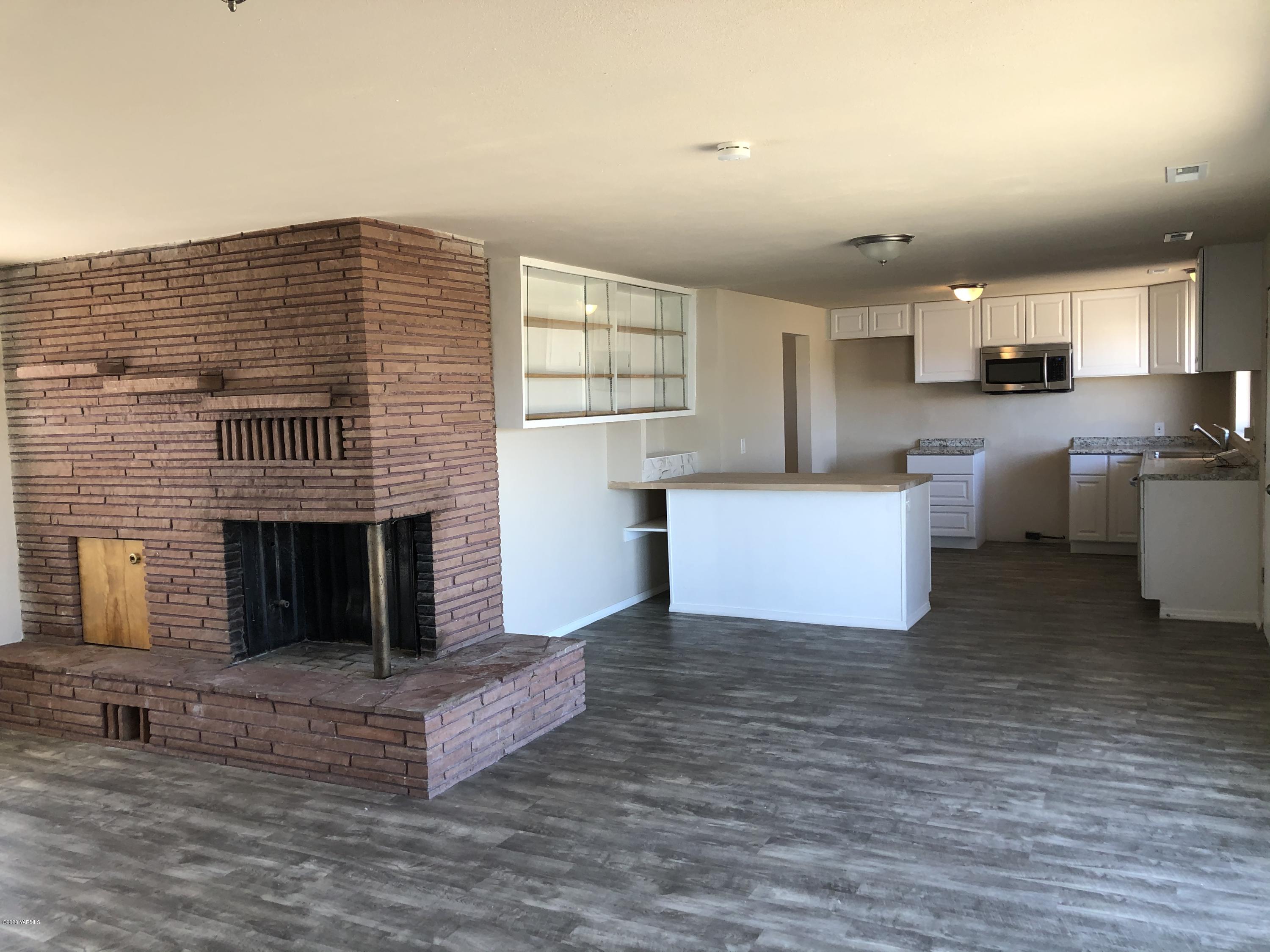 4950 Lateral A Road Wapato, WA 98951 - Photo 14 of 31 a living room with furniture and a fireplace