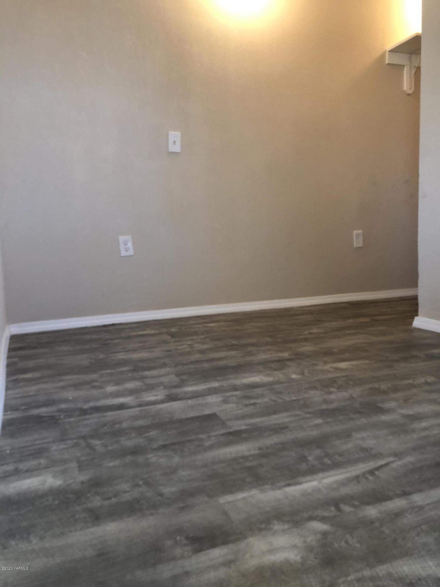 4950 Lateral A Road Wapato, WA 98951 - Photo 21 of 31 a view of an empty room with wooden floor