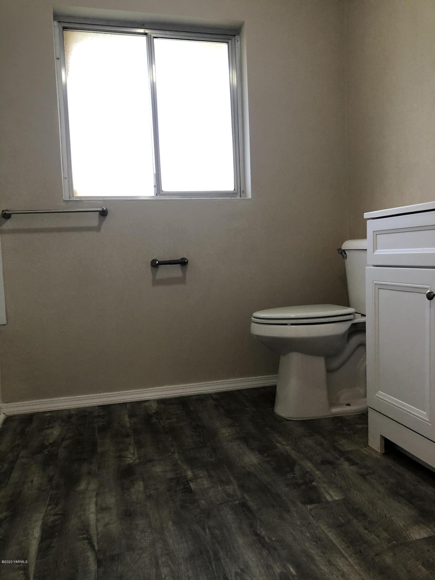4950 Lateral A Road Wapato, WA 98951 - Photo 24 of 31 a bathroom with a toilet sink and window