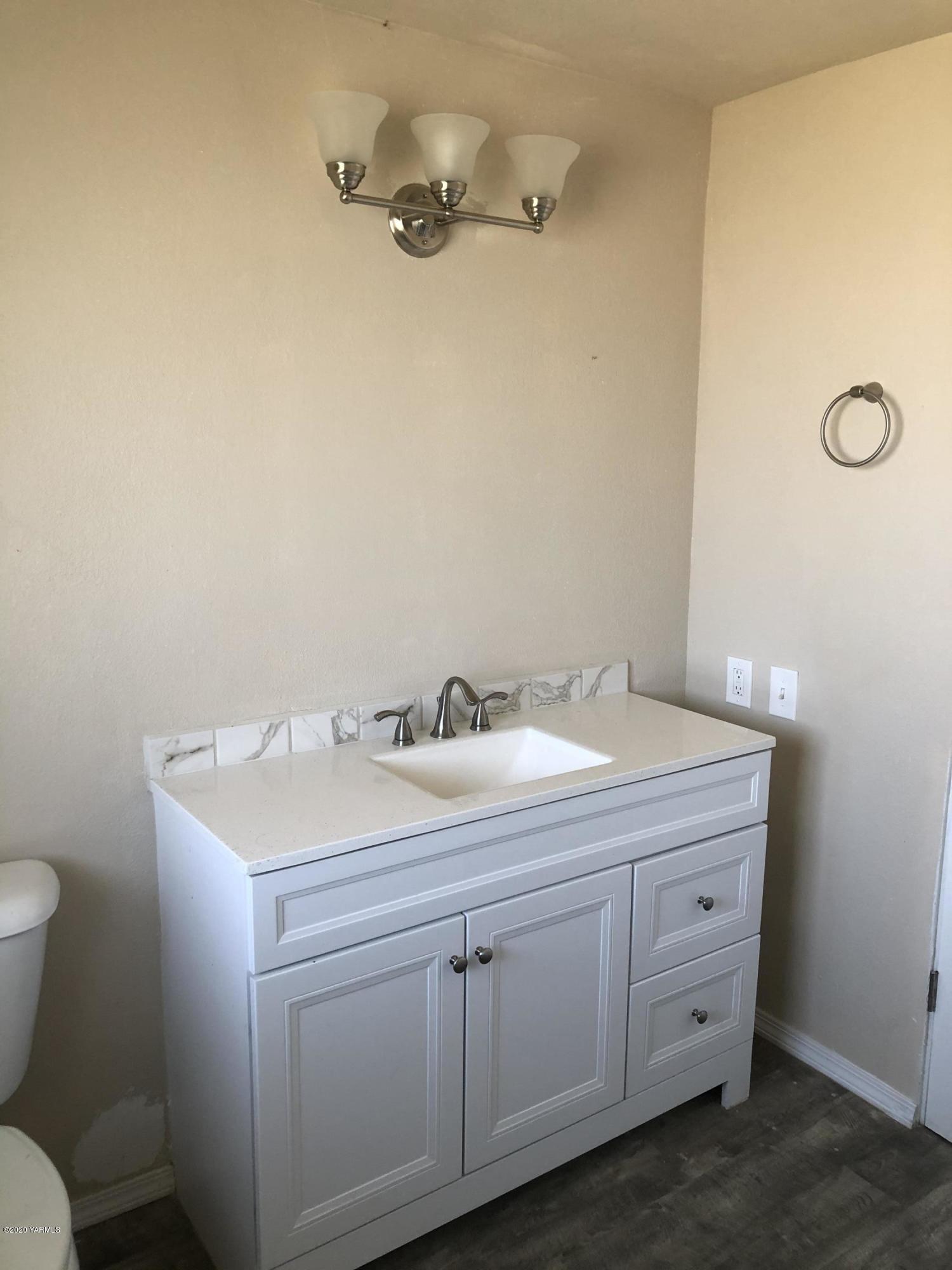 4950 Lateral A Road Wapato, WA 98951 - Photo 25 of 31 a bathroom with a sink toilet and vanity