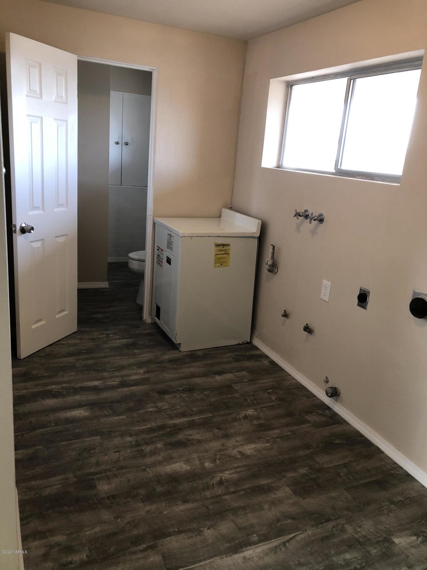 4950 Lateral A Road Wapato, WA 98951 - Photo 26 of 31 a view of a bathroom with wooden floor and a sink
