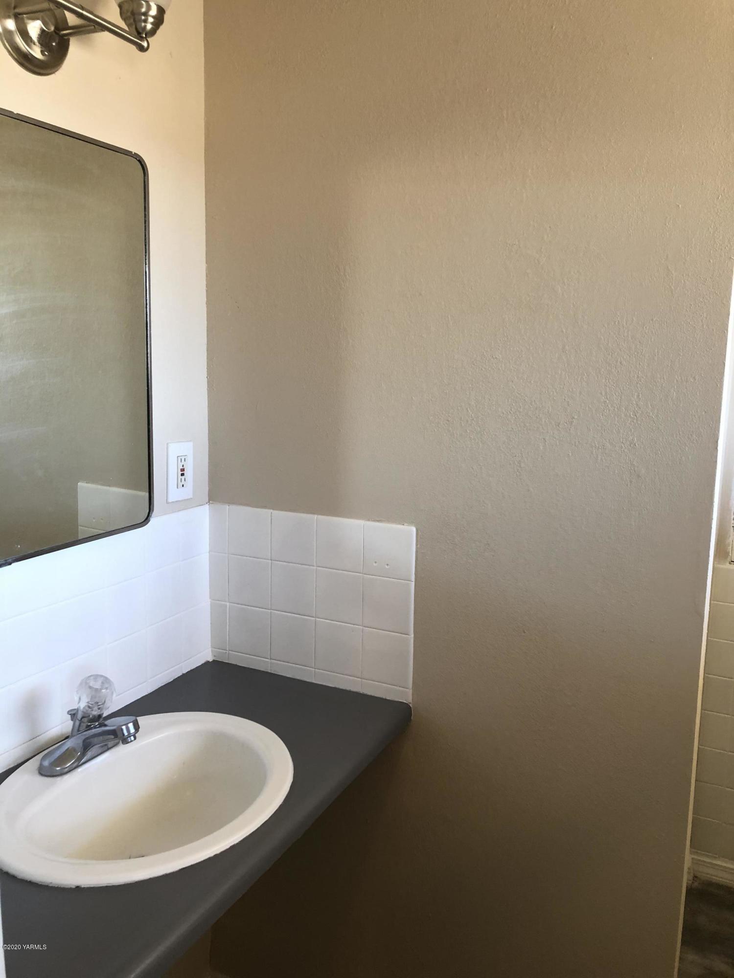 4950 Lateral A Road Wapato, WA 98951 - Photo 29 of 31 a bathroom with a sink and a mirror