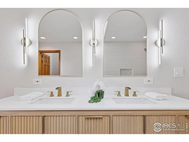 a bathroom with a sink a vanity and mirror