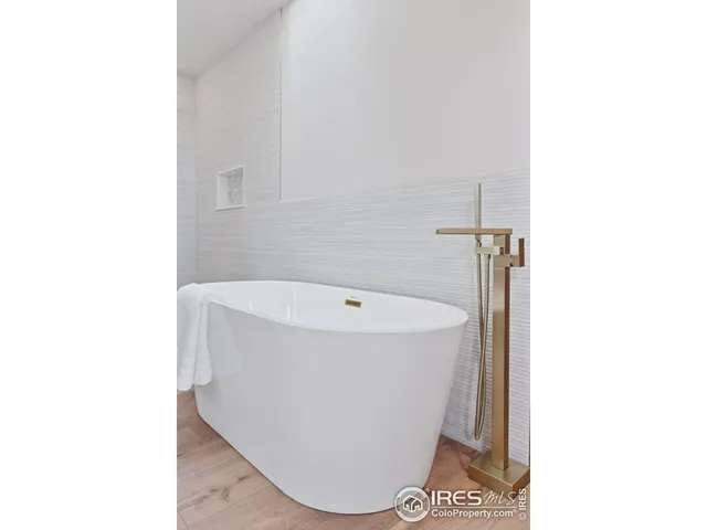 a white bath tub sitting in a bathroom