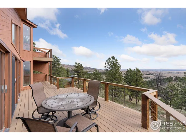 a view of a balcony with furniture