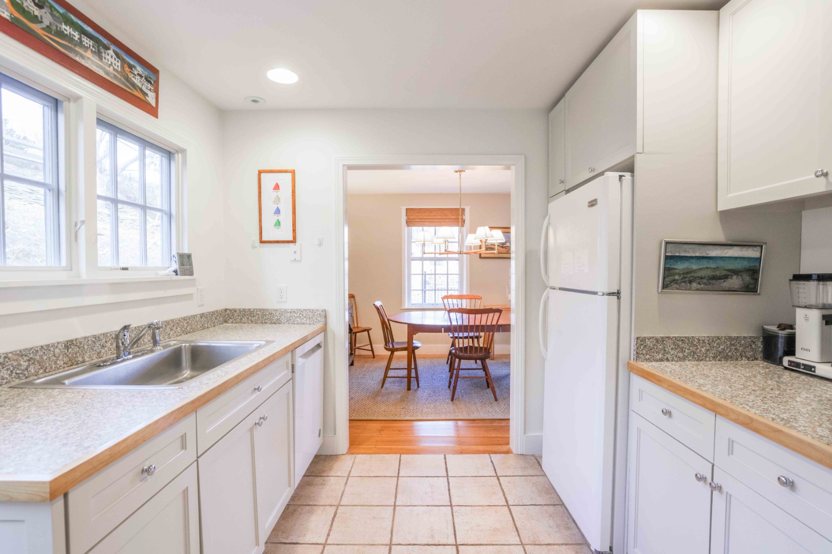 13 West Chester Street Nantucket, MA 02554 - Photo 11 of 32 a kitchen with granite countertop a sink and a refrigerator