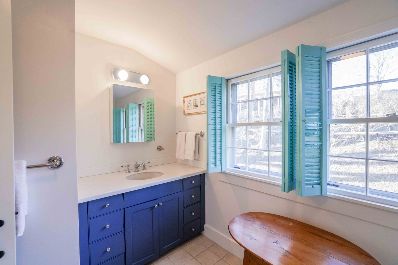 13 West Chester Street Nantucket, MA 02554 - Photo 25 of 32 a bathroom with a sink a mirror a window and a toilet